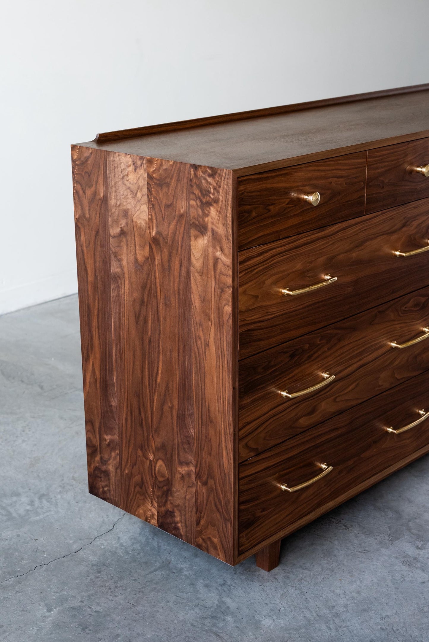 The “Levine Dresser”, Mid Century Modern Hardwood Dresser with a Gallery Rail & Hand Cut Joinery. Fully Customizable Sizing and Drawers.