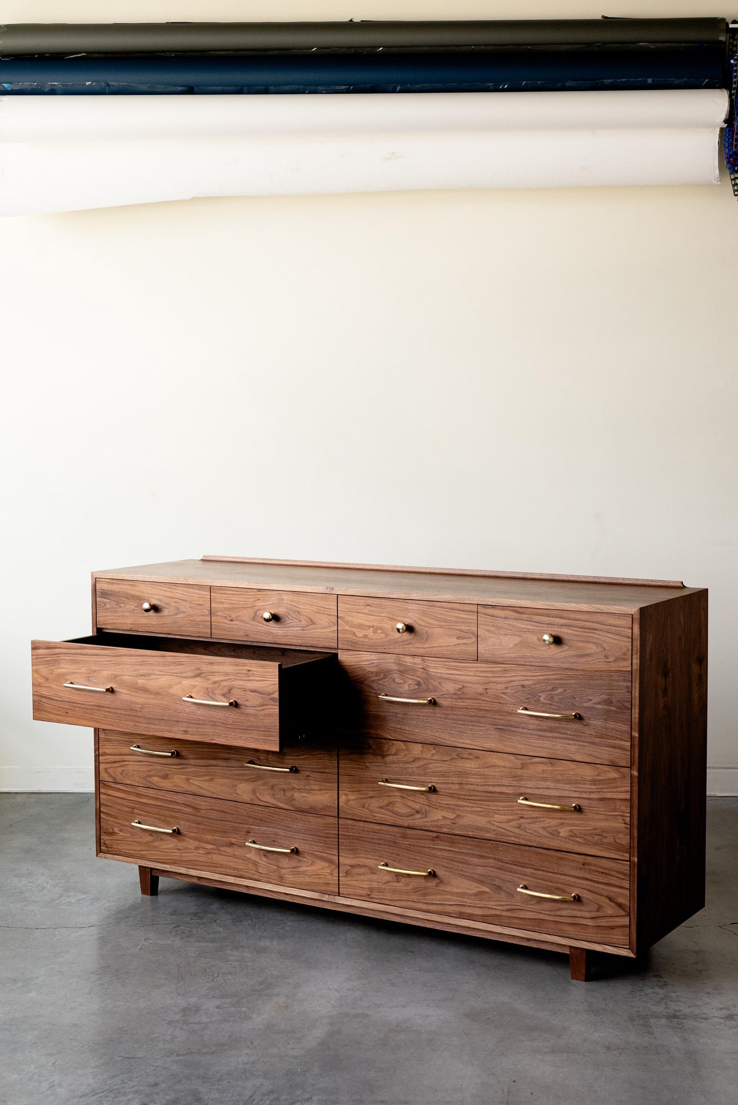 The “Levine Dresser”, Mid Century Modern Hardwood Dresser with a Gallery Rail & Hand Cut Joinery. Fully Customizable Sizing and Drawers.