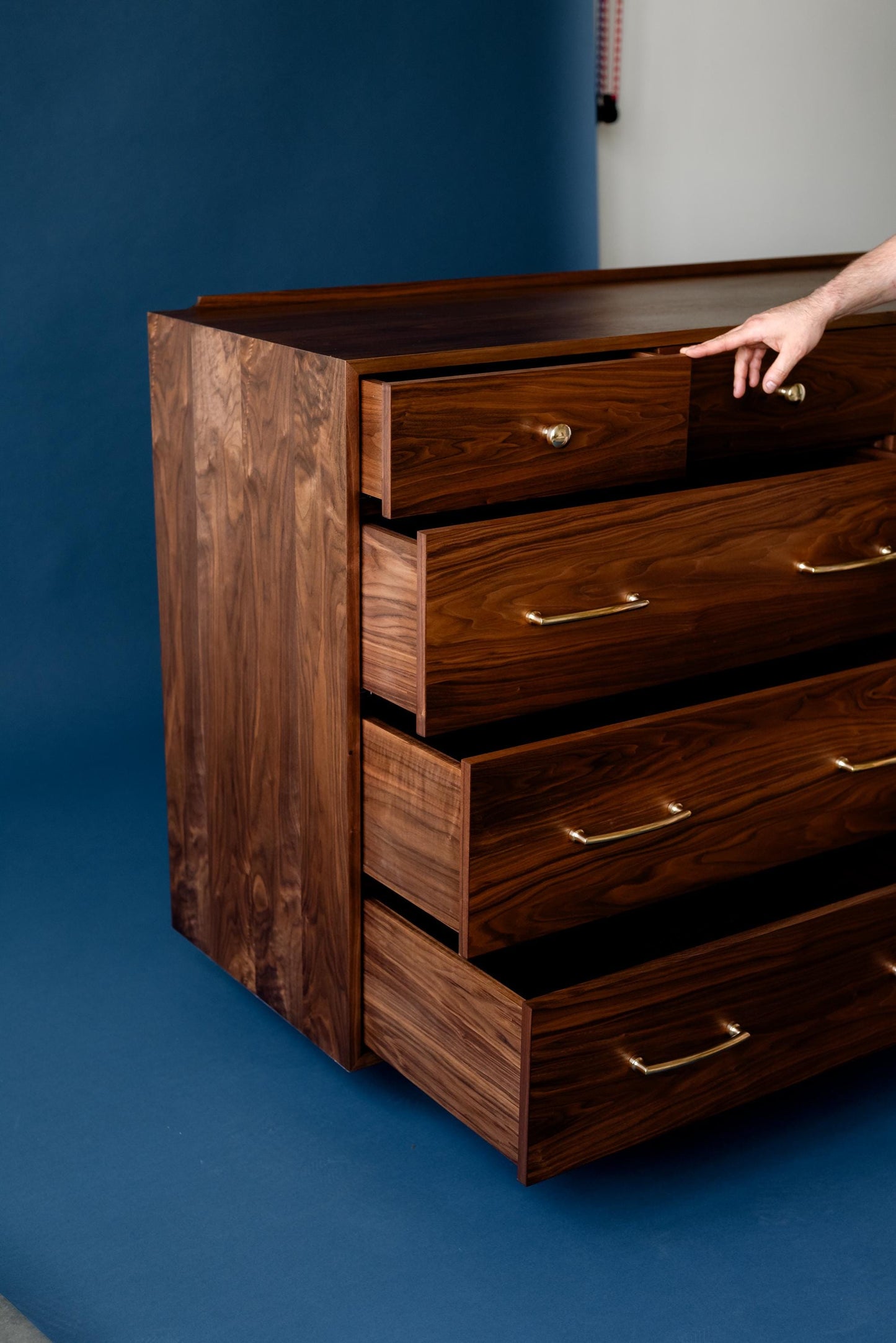The “Levine Dresser”, Mid Century Modern Hardwood Dresser with a Gallery Rail & Hand Cut Joinery. Fully Customizable Sizing and Drawers.