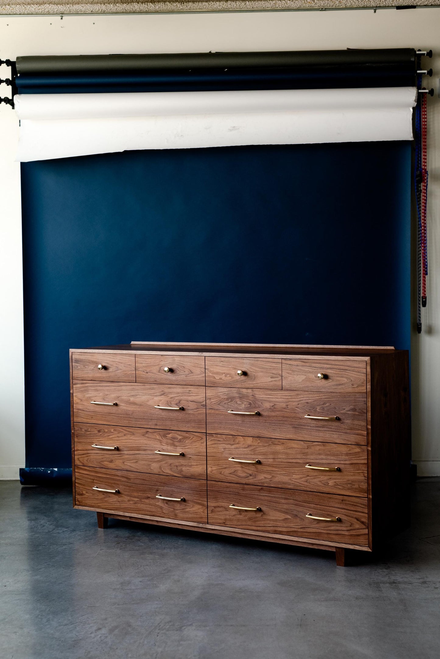 The “Levine Dresser”, Mid Century Modern Hardwood Dresser with a Gallery Rail & Hand Cut Joinery. Fully Customizable Sizing and Drawers.