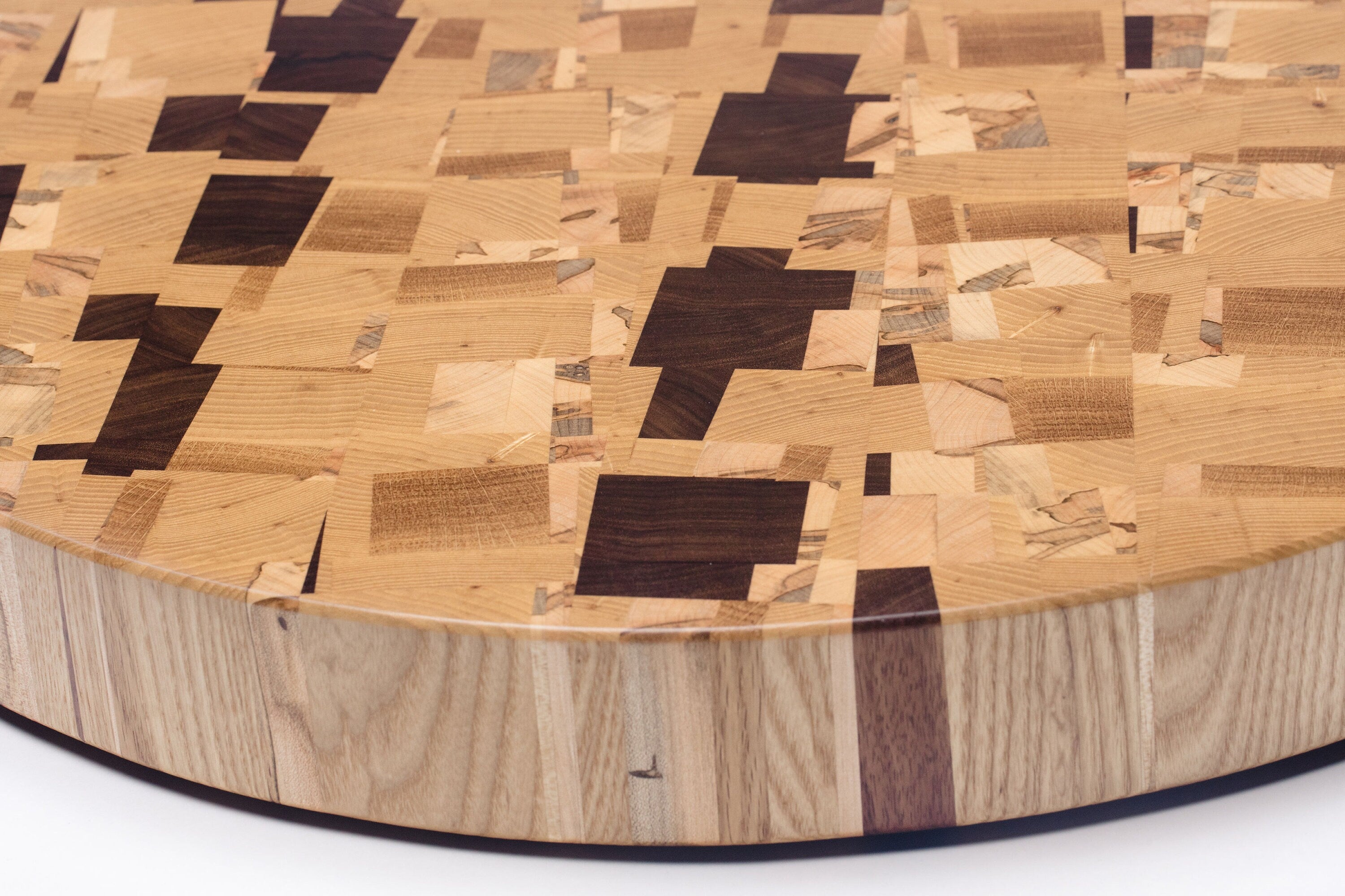 An lazy susan table centerpiece represents craft woodworking services offered in Eugene by Handhold Studio.